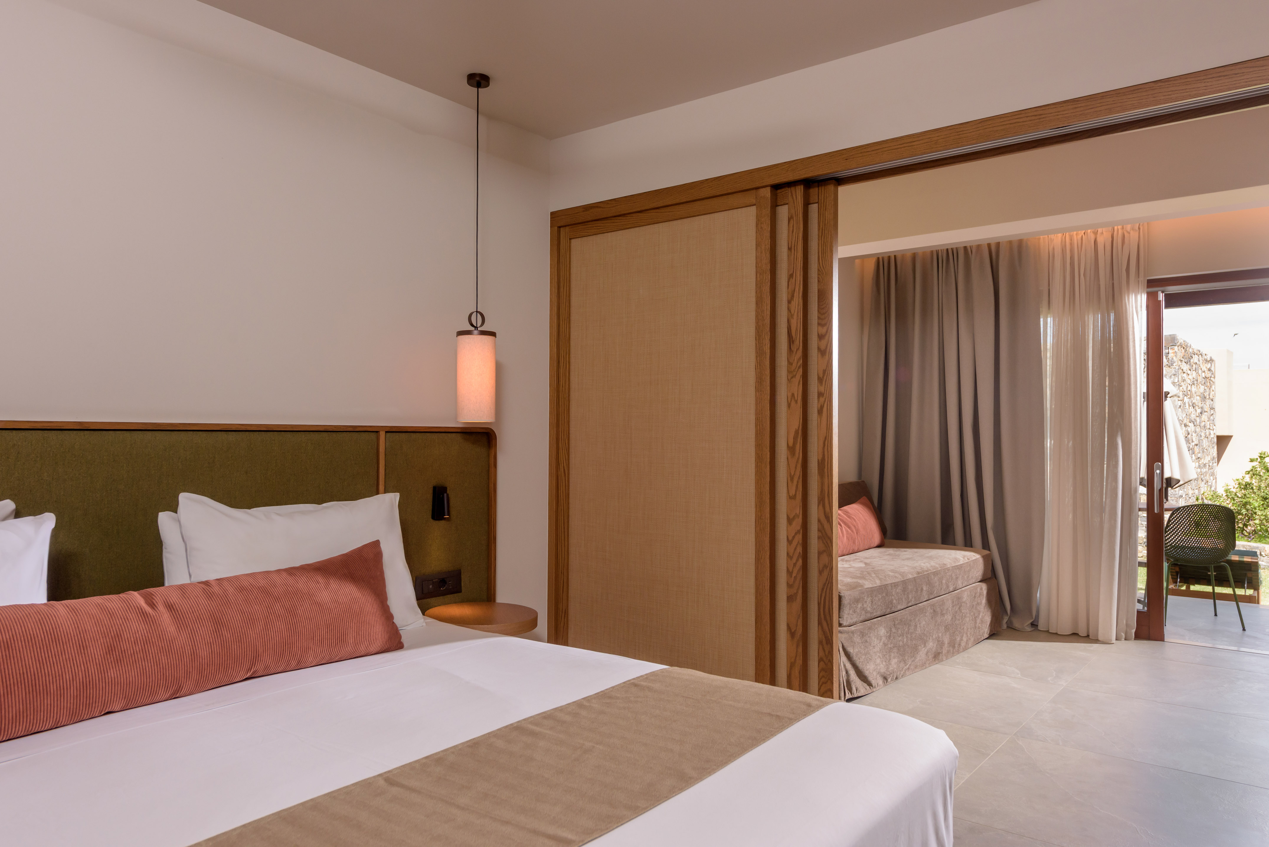 a bedroom with a bed and a sliding door