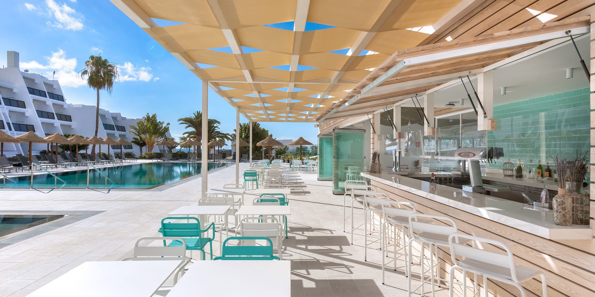 a pool with tables and chairs