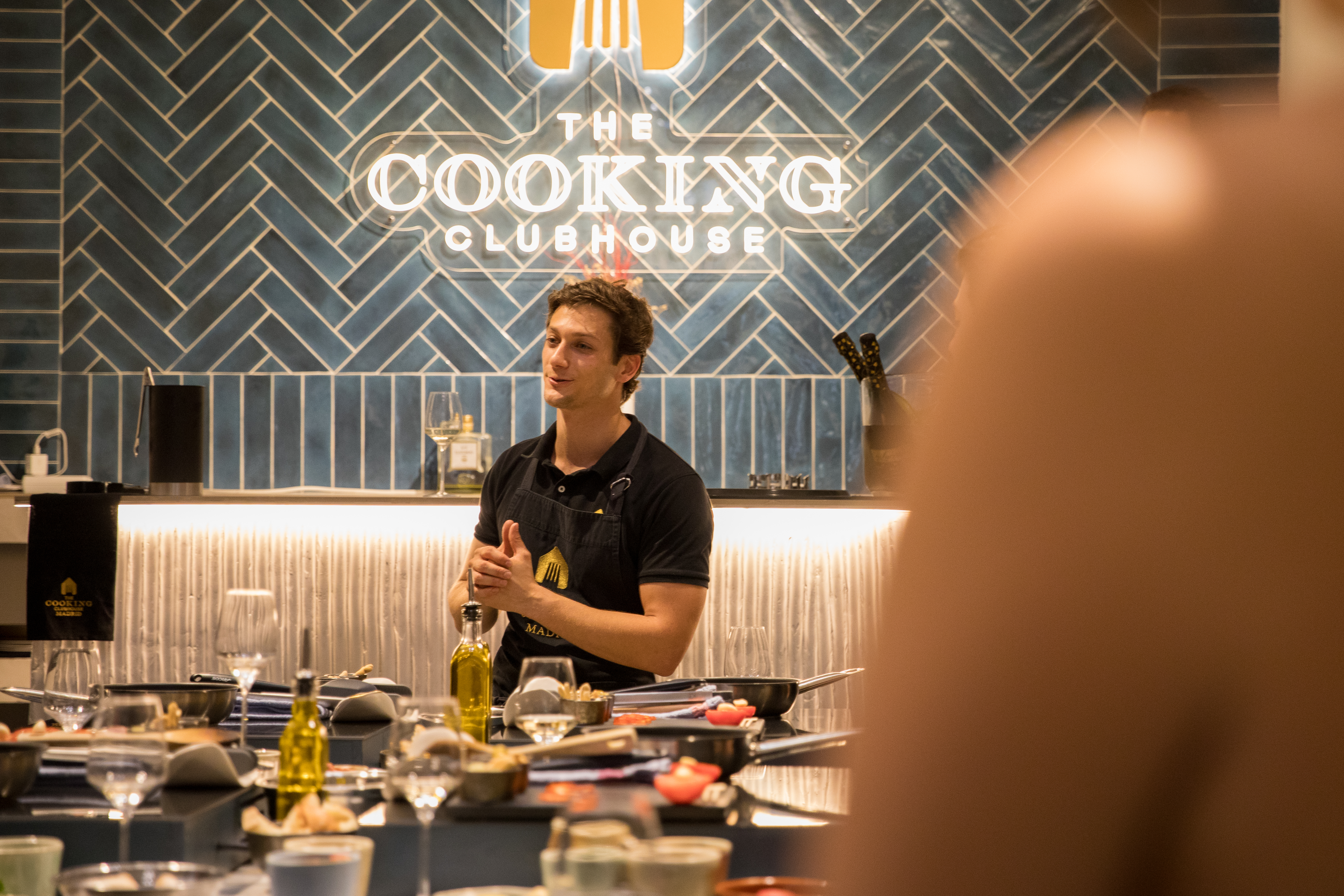 a man in a black apron