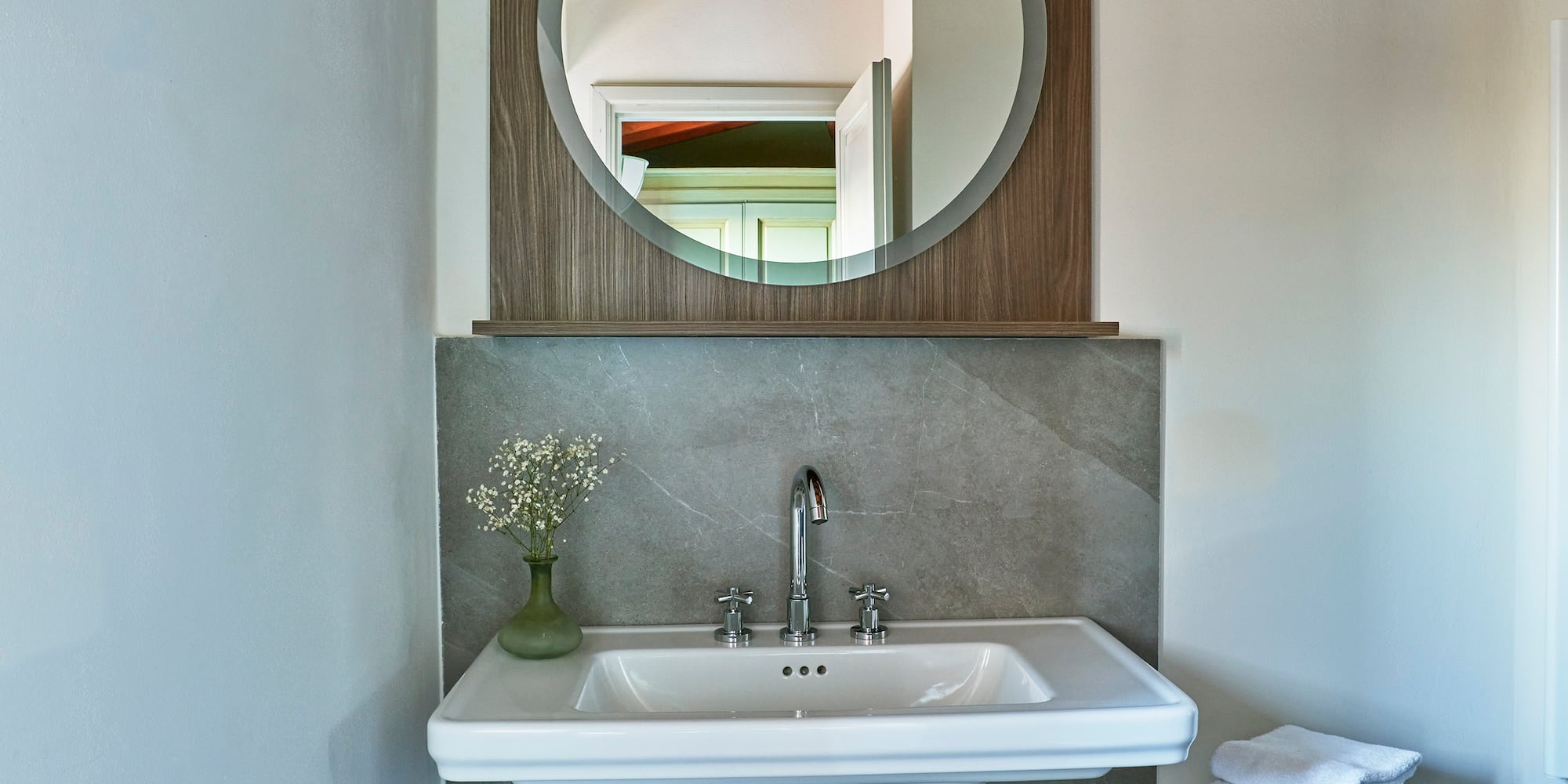a sink and mirror in a bathroom