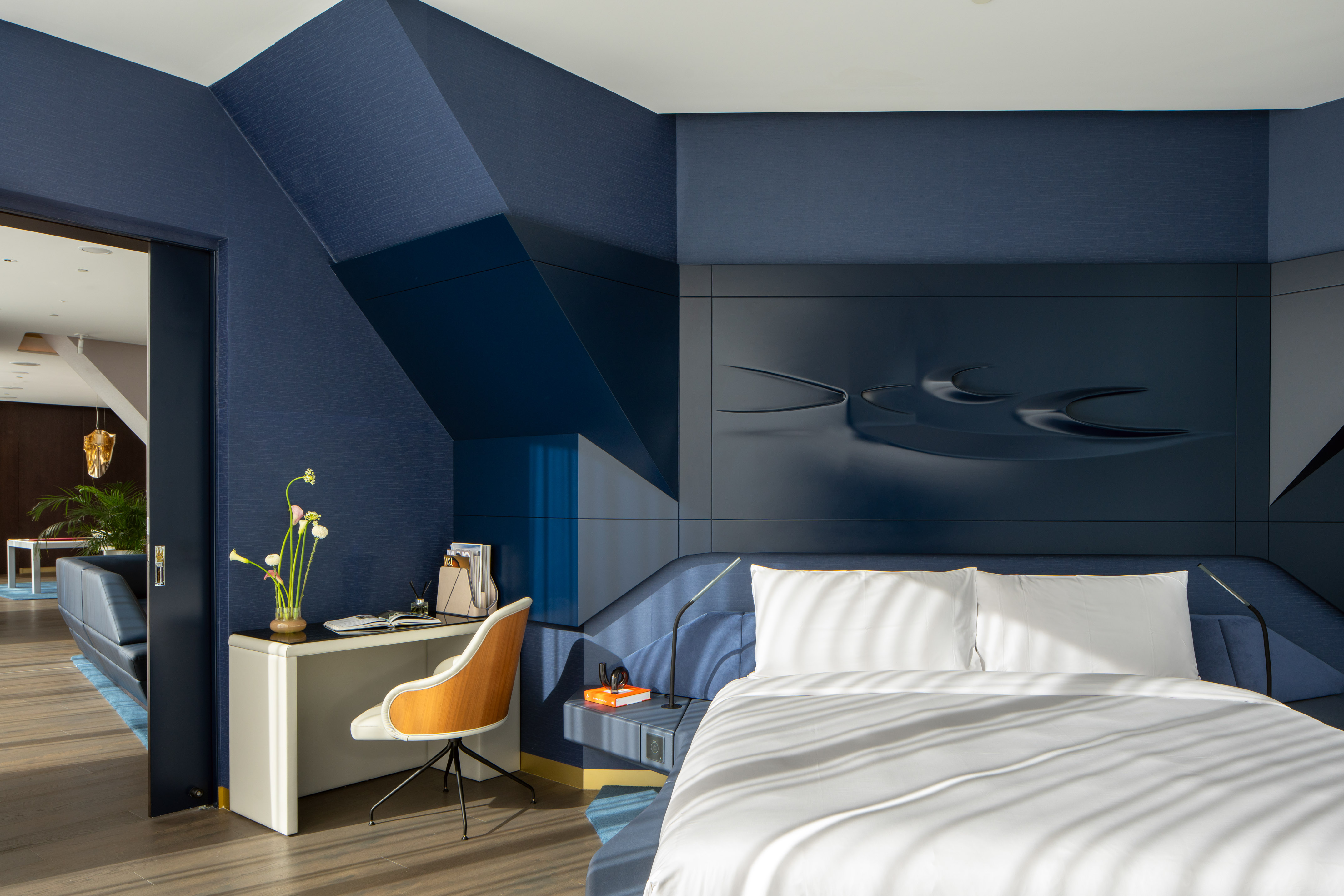 a room with a bed and a desk