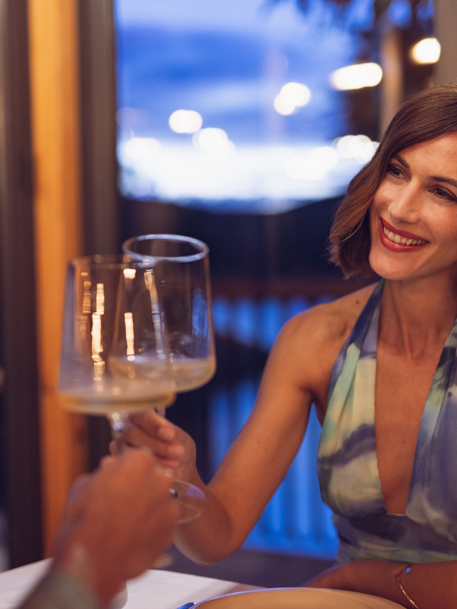 a woman holding a wine glass