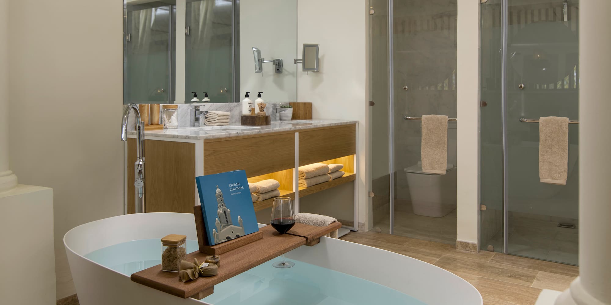 a bathroom with a tub and a glass shower