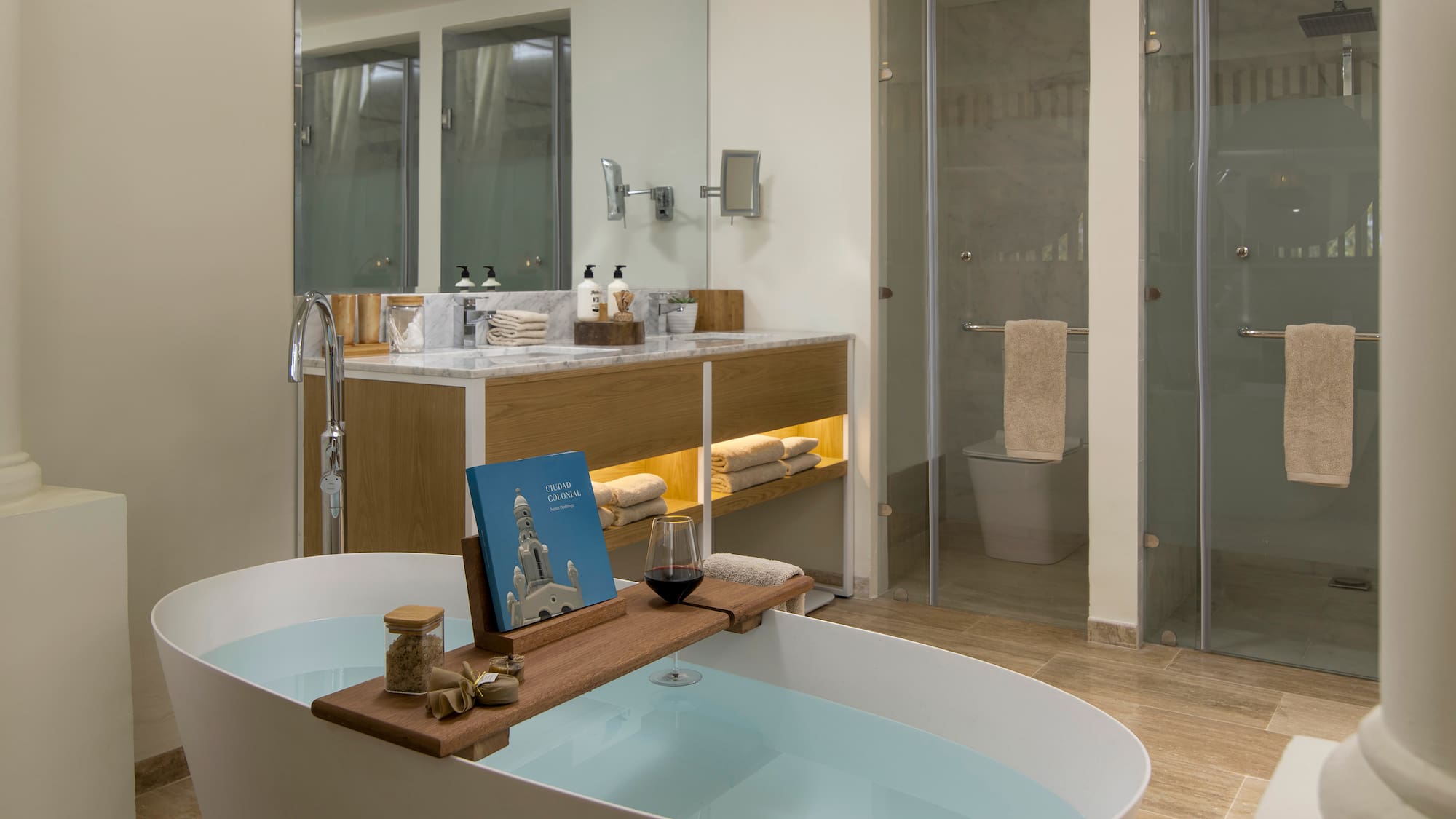 a bathroom with a tub and a glass shower