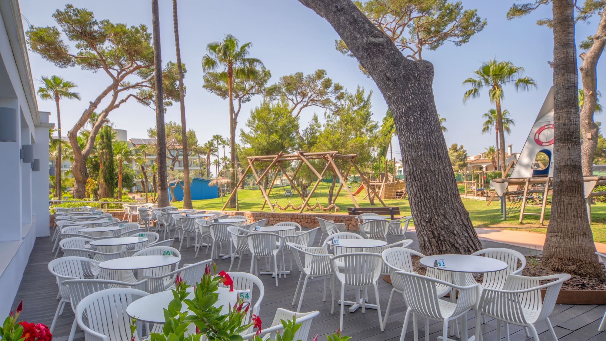 a patio with tables and chairs
