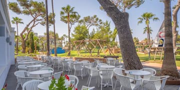 a patio with tables and chairs