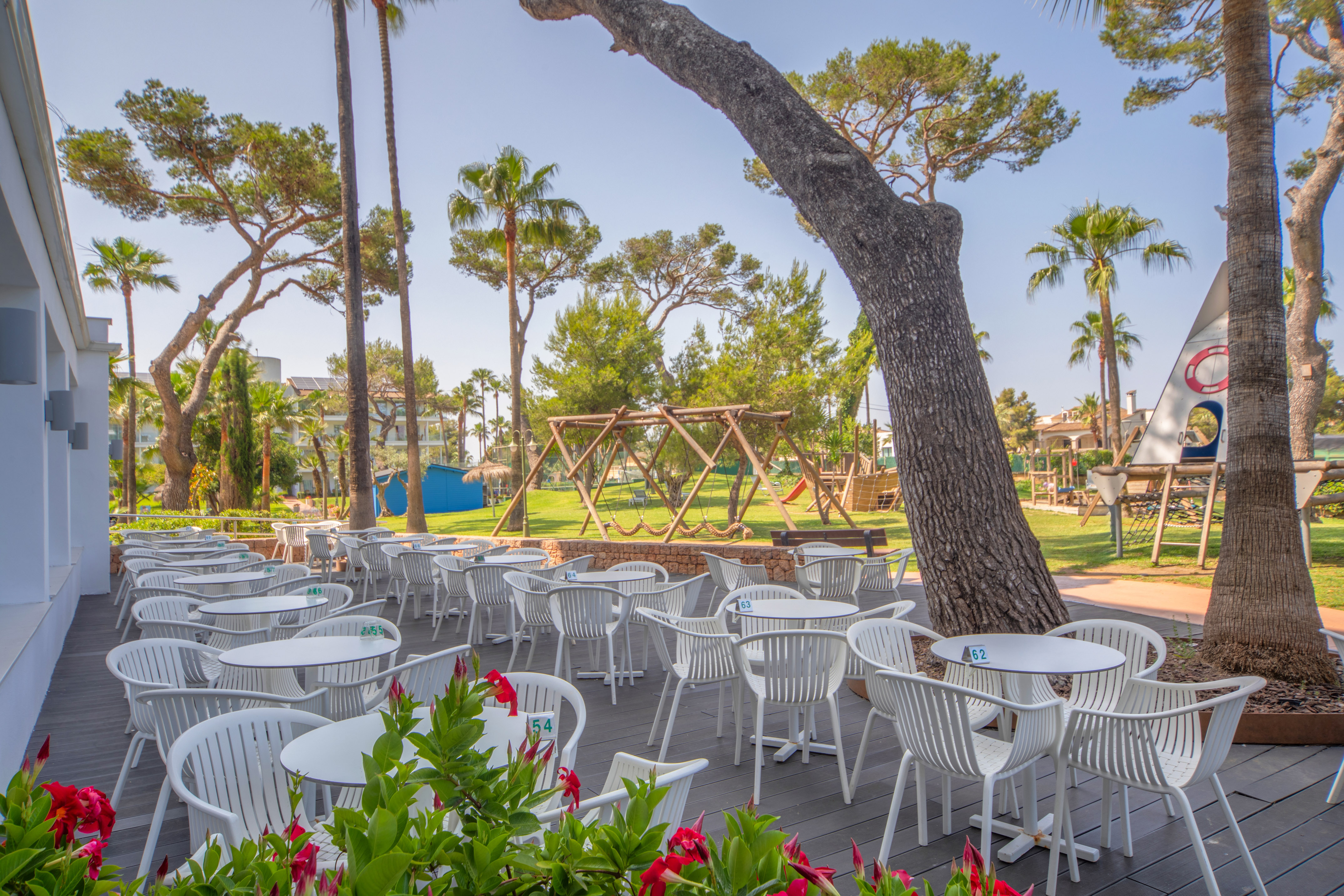 a patio with tables and chairs