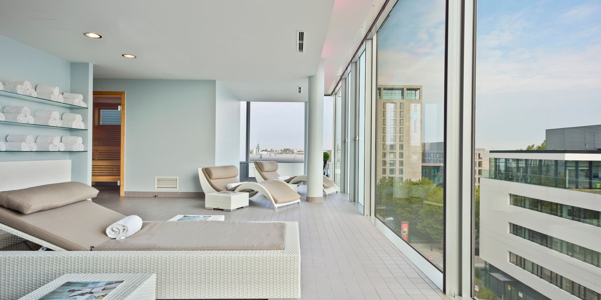 a room with chairs and a large window