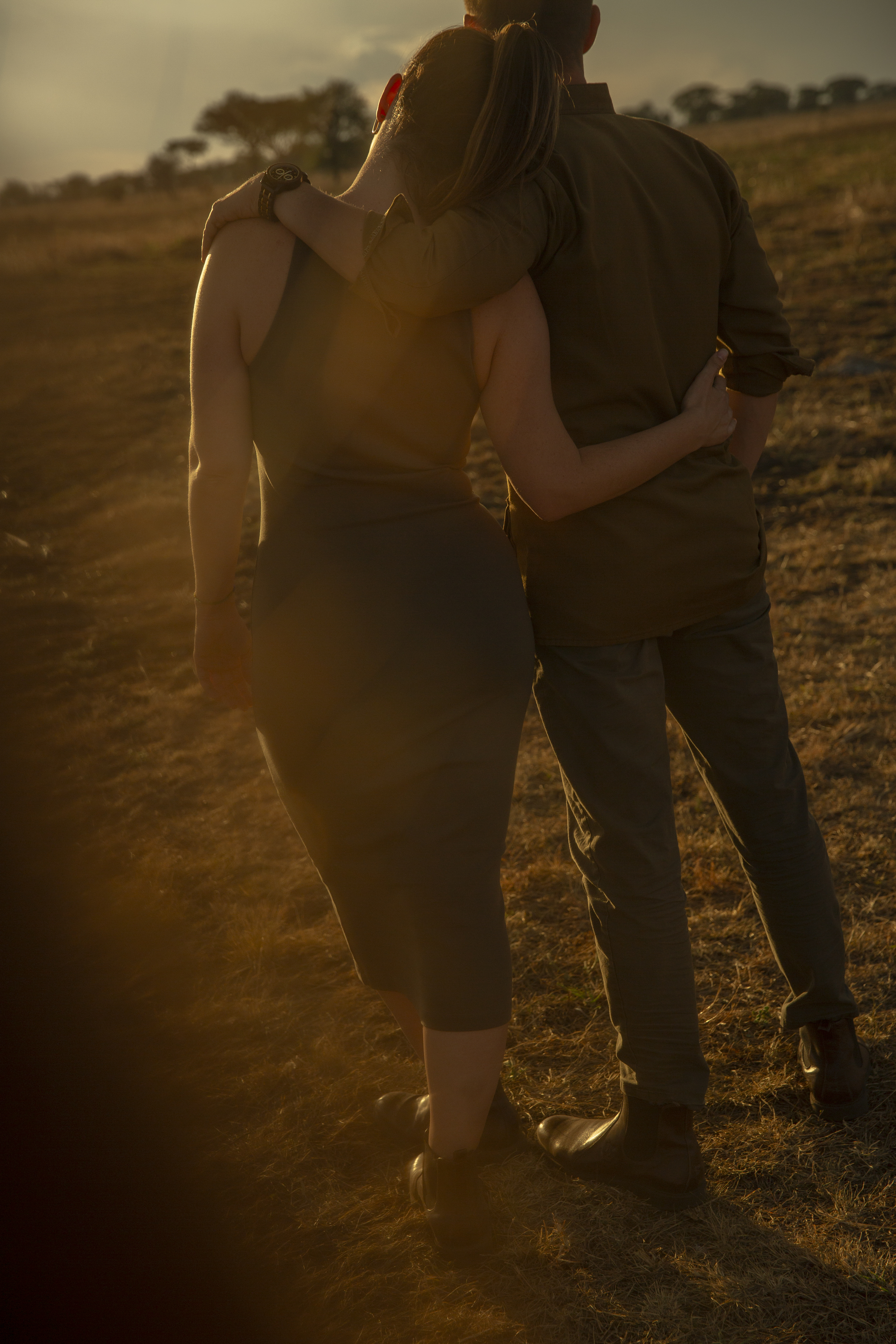 a man and woman hugging each other