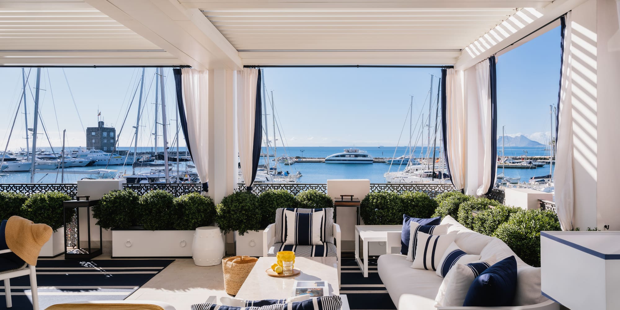 a room with a view of the water and boats