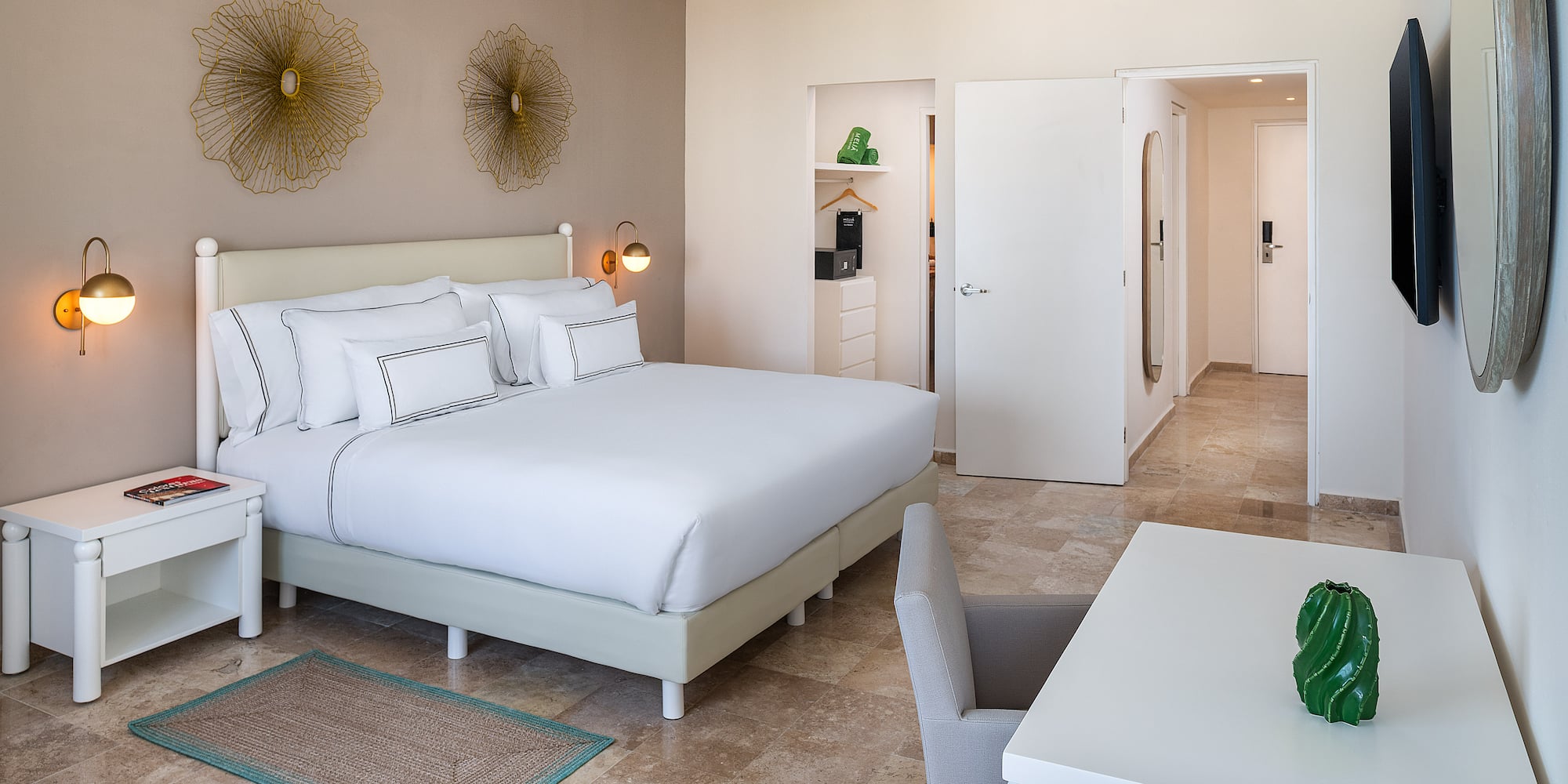 a bedroom with a bed and a table