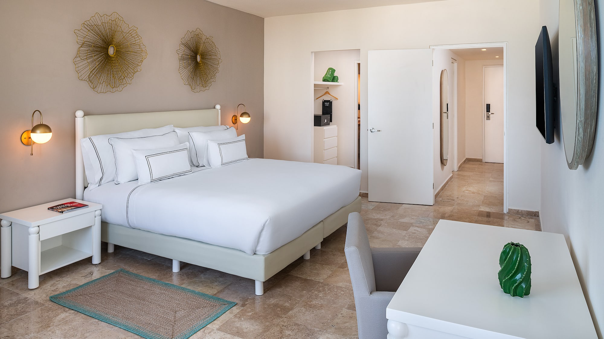 a bedroom with a bed and a table