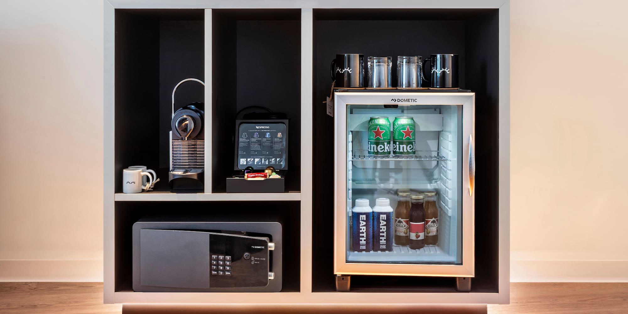 a refrigerator with drinks and a microwave
