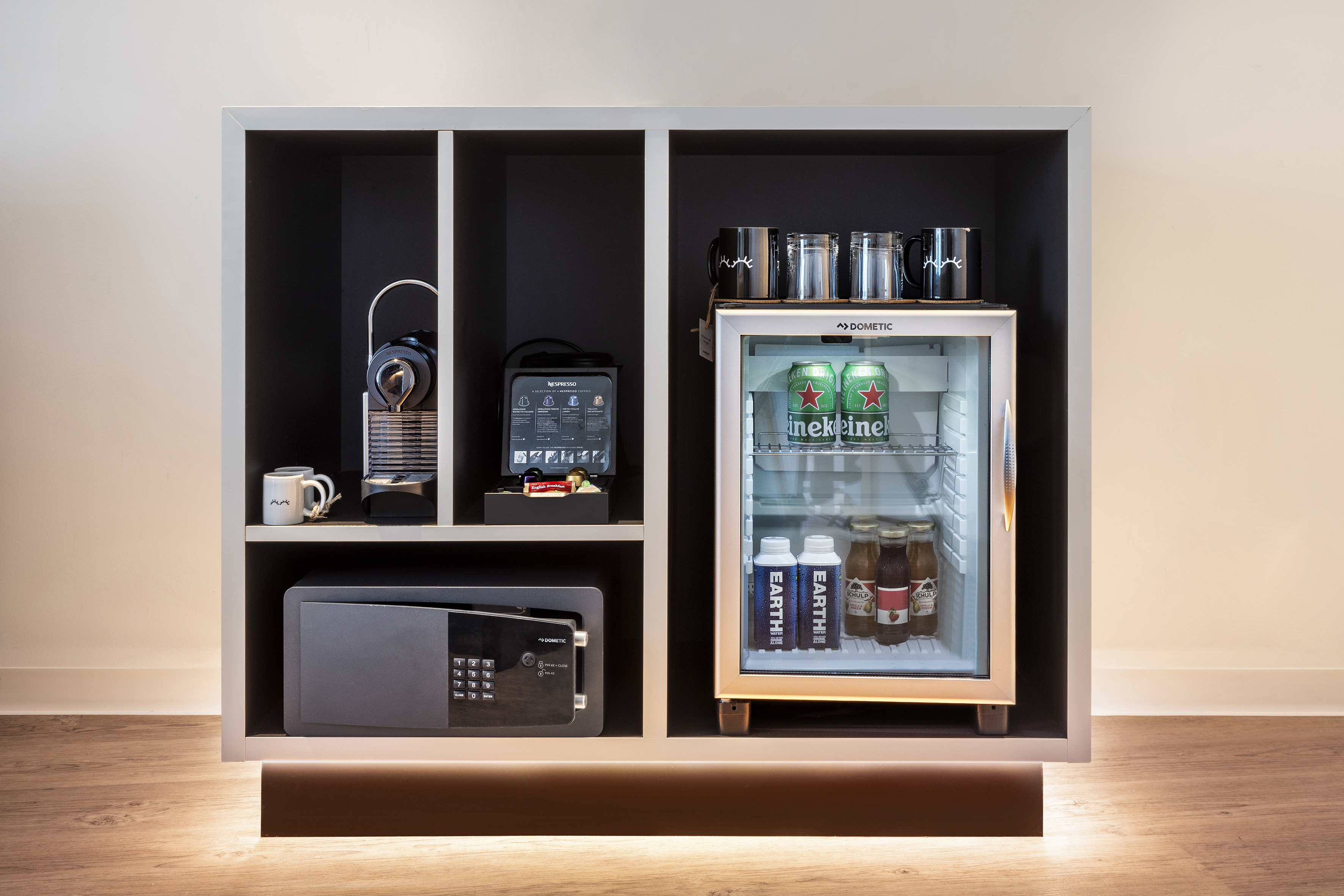 a refrigerator with drinks and a microwave