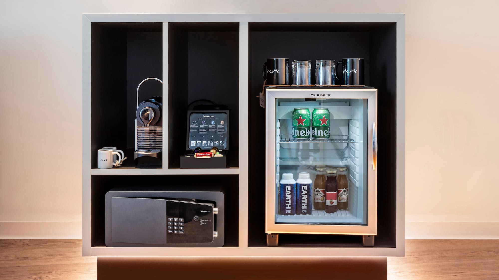 a refrigerator with drinks and a microwave