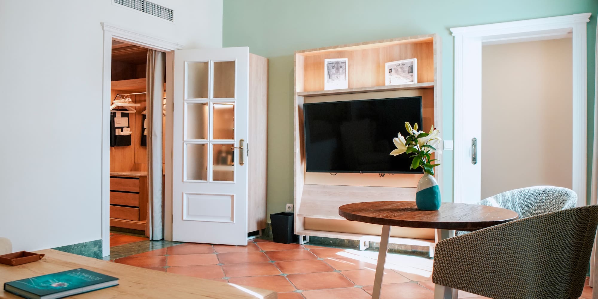 a room with a tv and a table