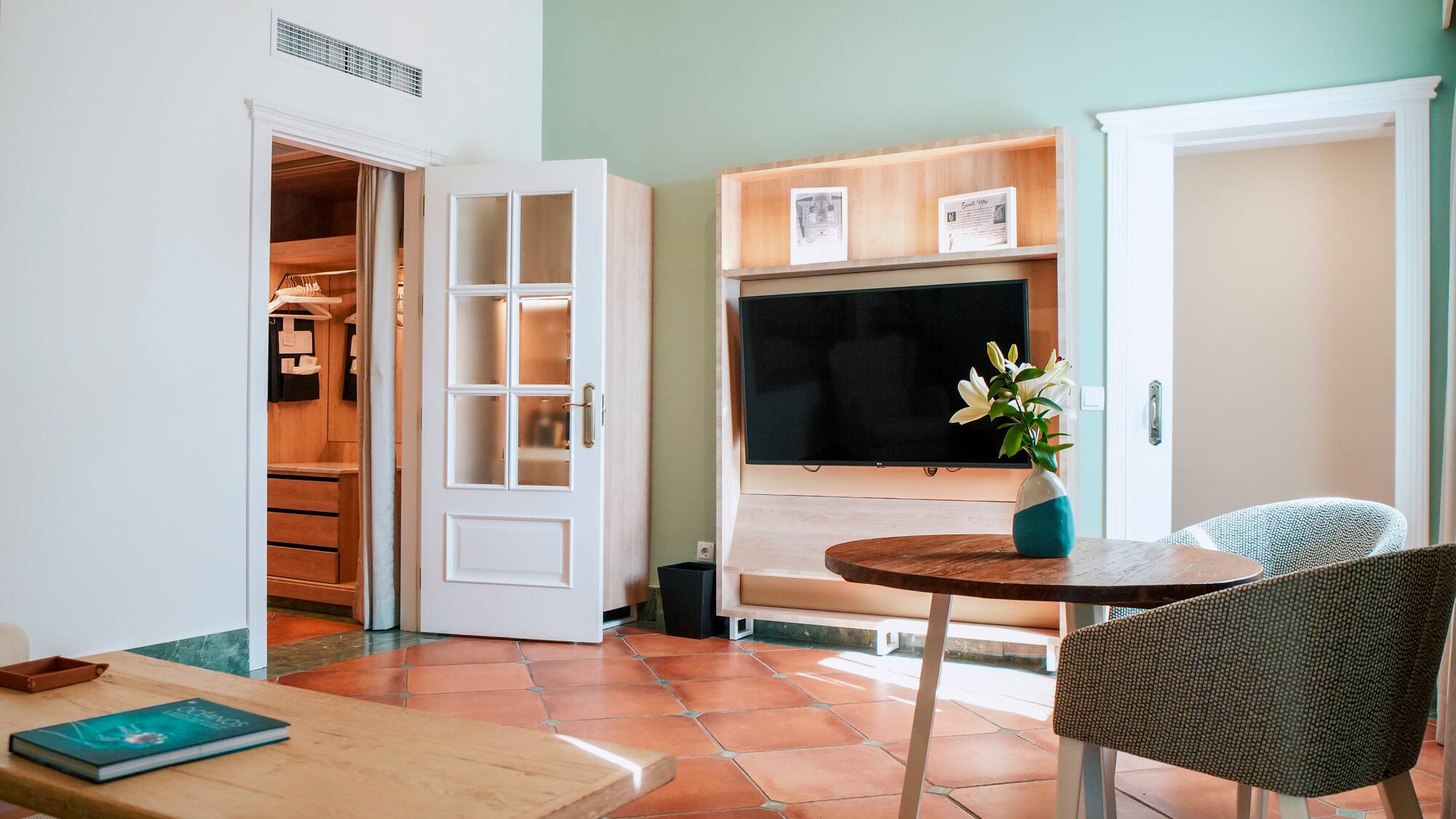 a room with a tv and a table
