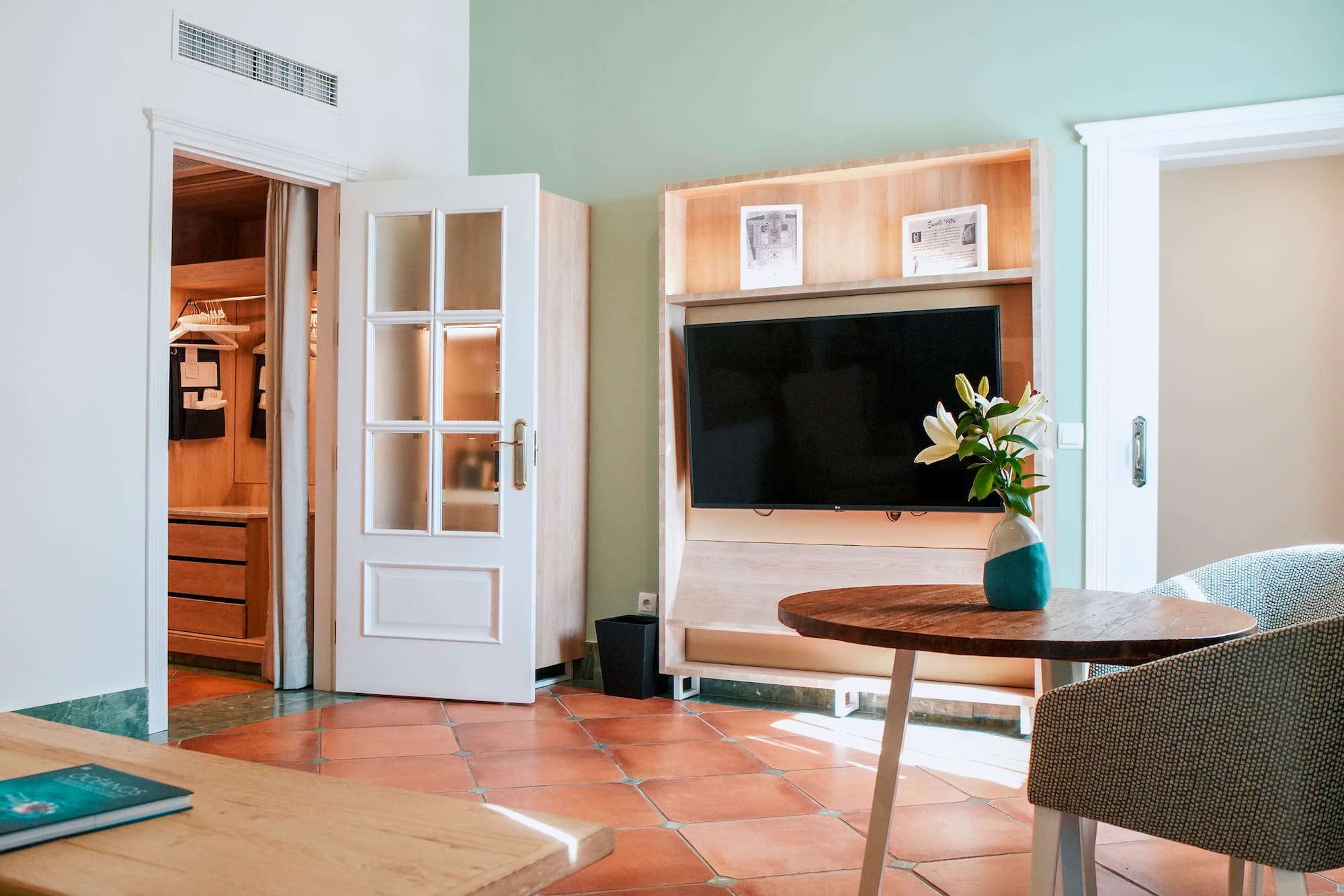 a room with a tv and a table