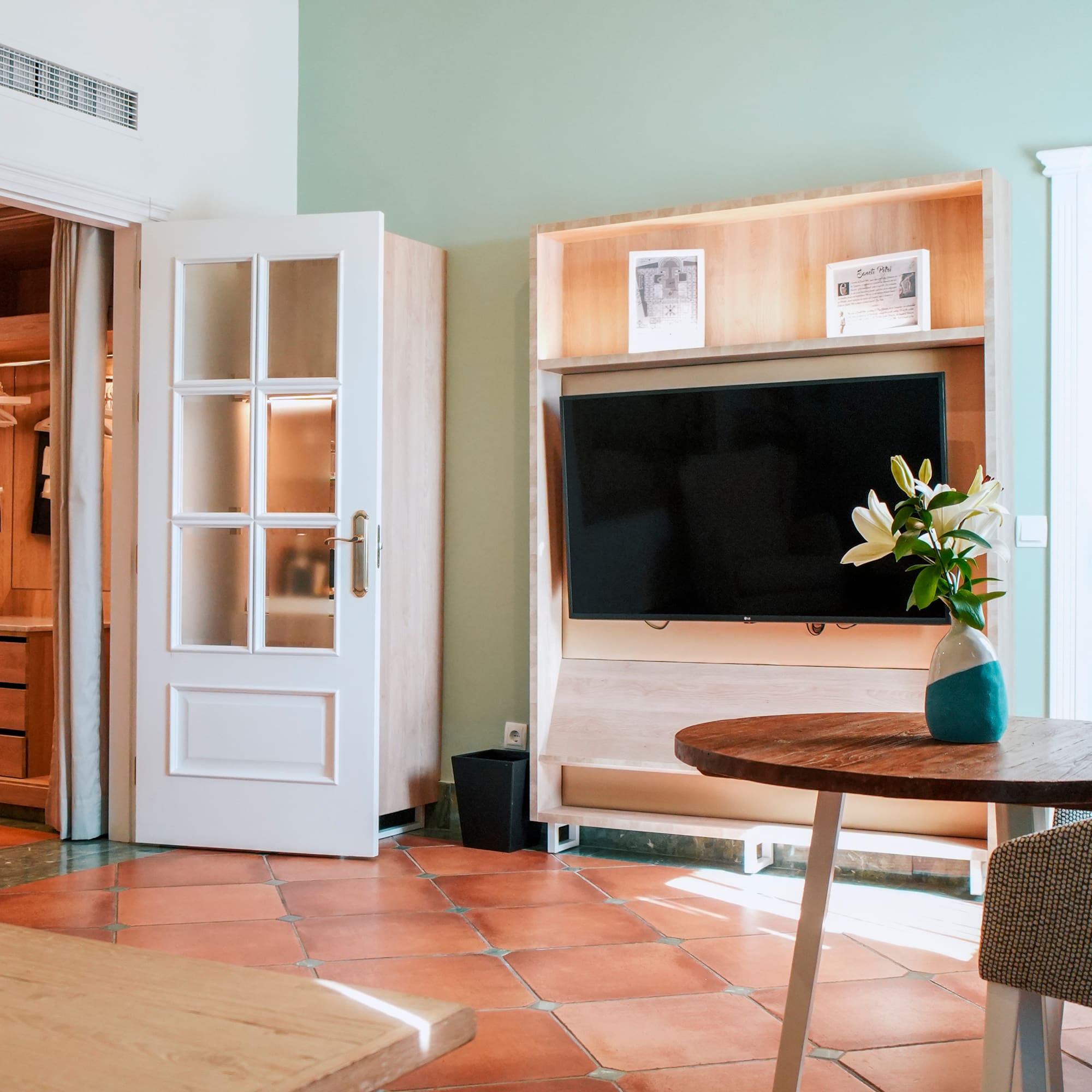 a room with a tv and a table