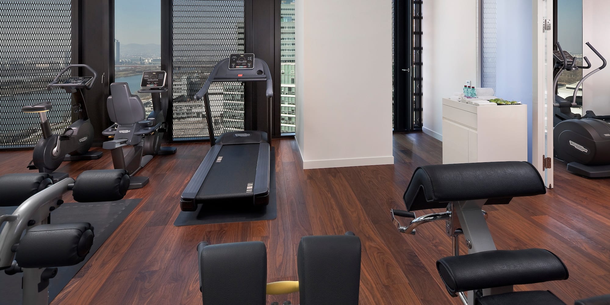 a room with exercise equipment and a window