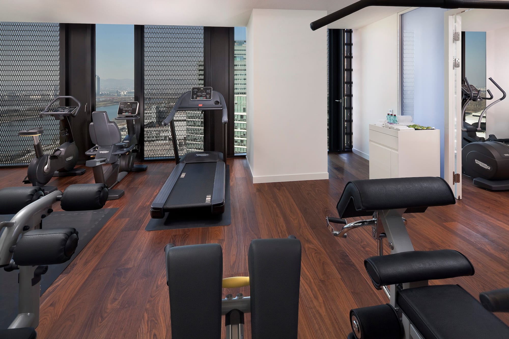 a room with exercise equipment and a window