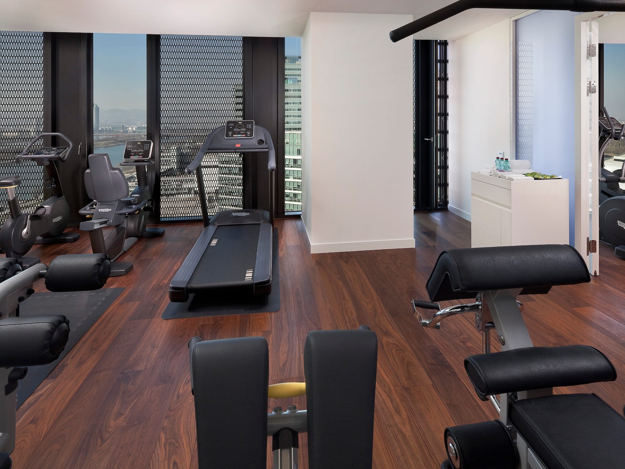 a room with exercise equipment and a window