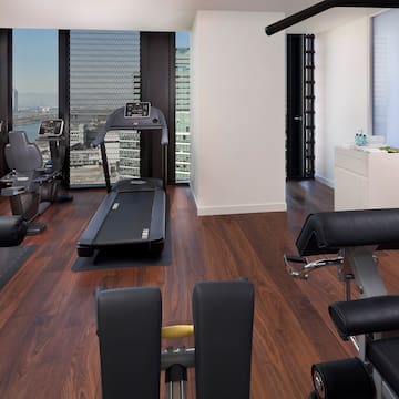 a room with exercise equipment and a window