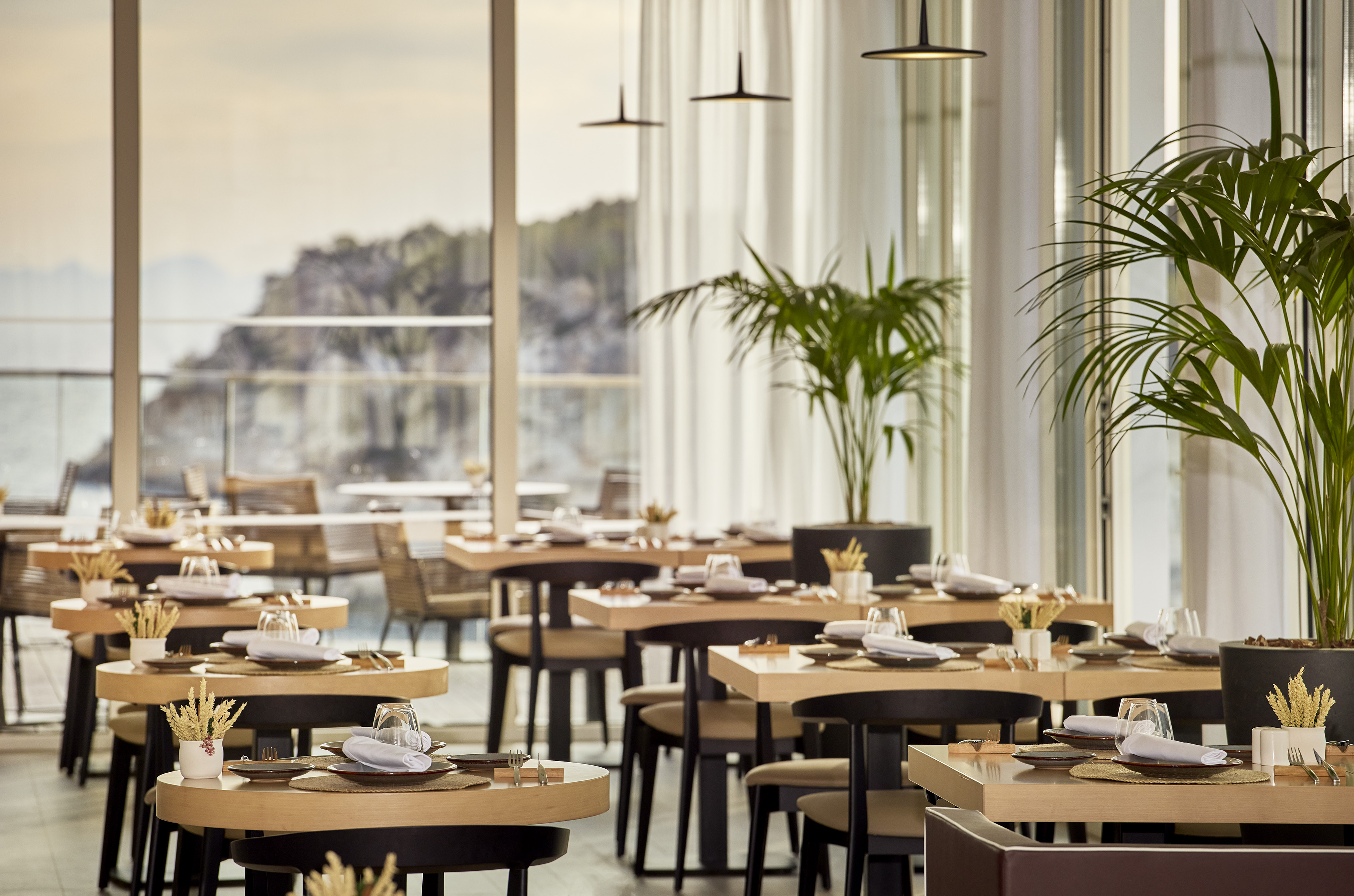 a restaurant with tables and chairs