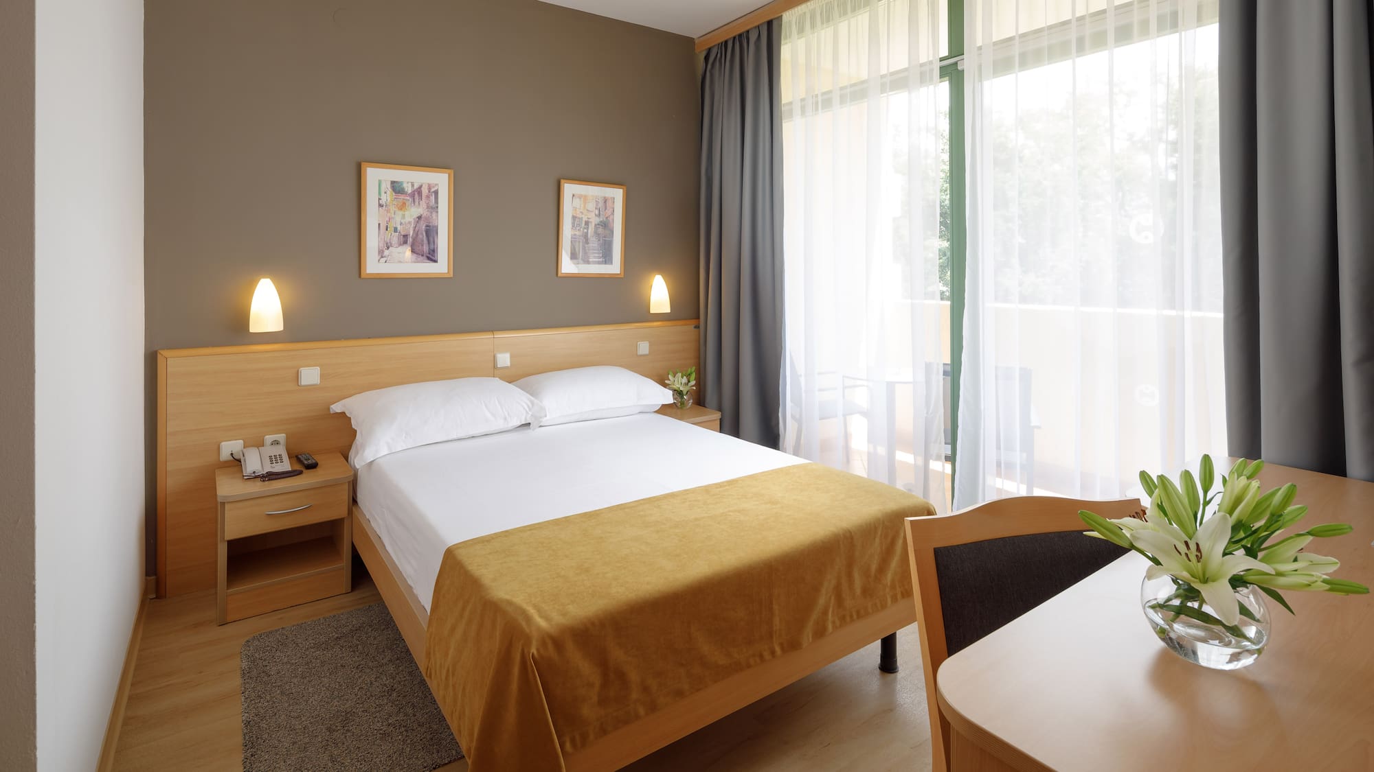 a bedroom with a bed and a table