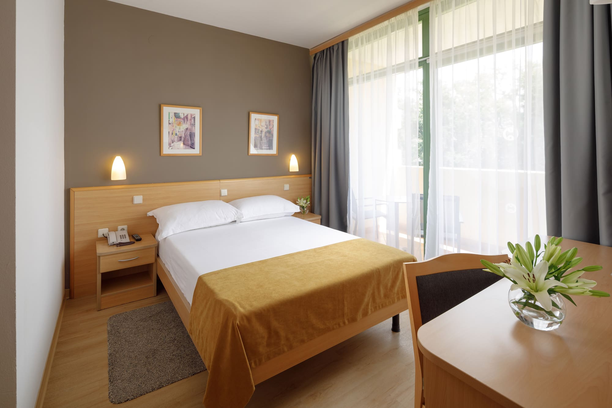 a bedroom with a bed and a table