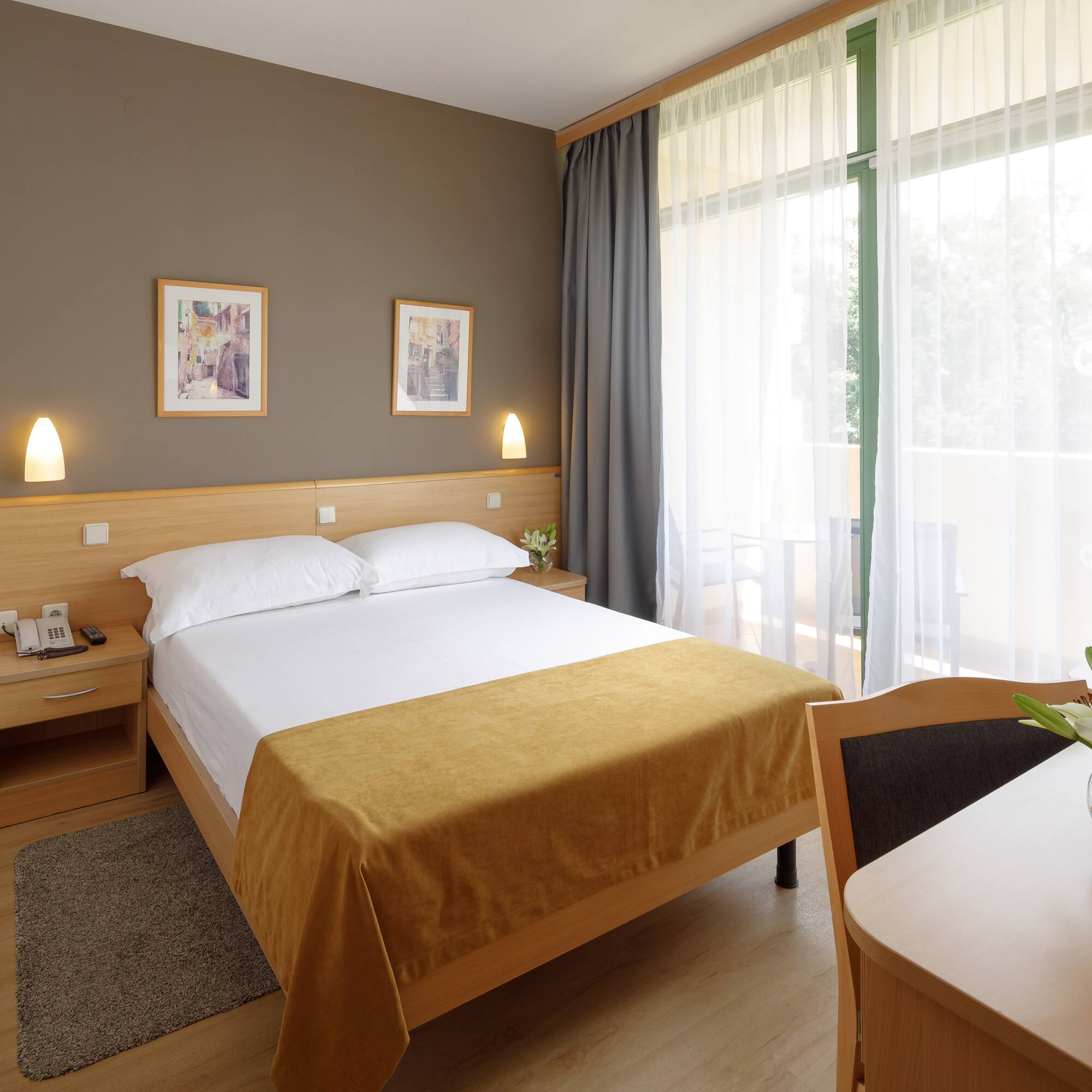 a bedroom with a bed and a table