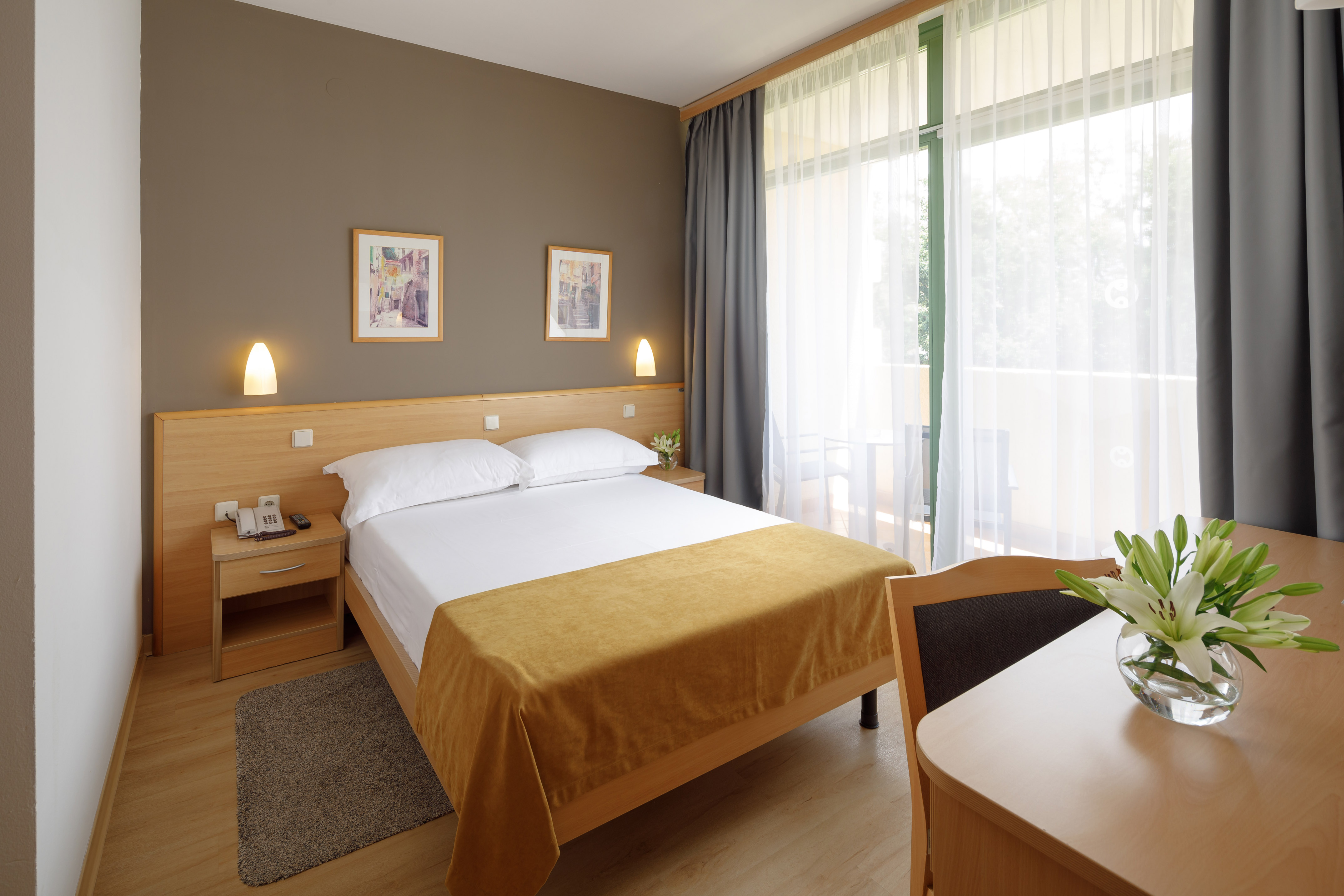 a bedroom with a bed and a table