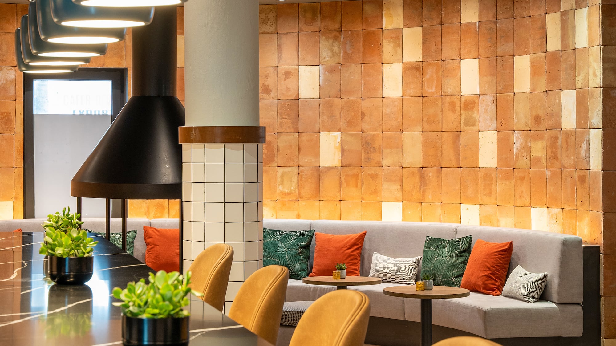 a room with a long table and chairs