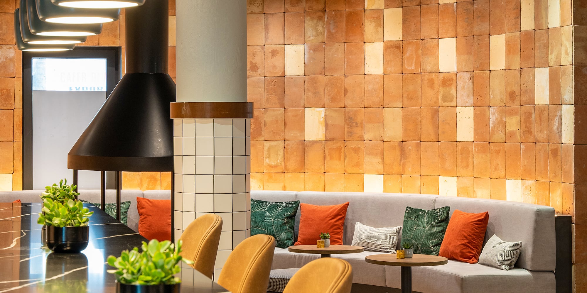 a room with a long table and chairs