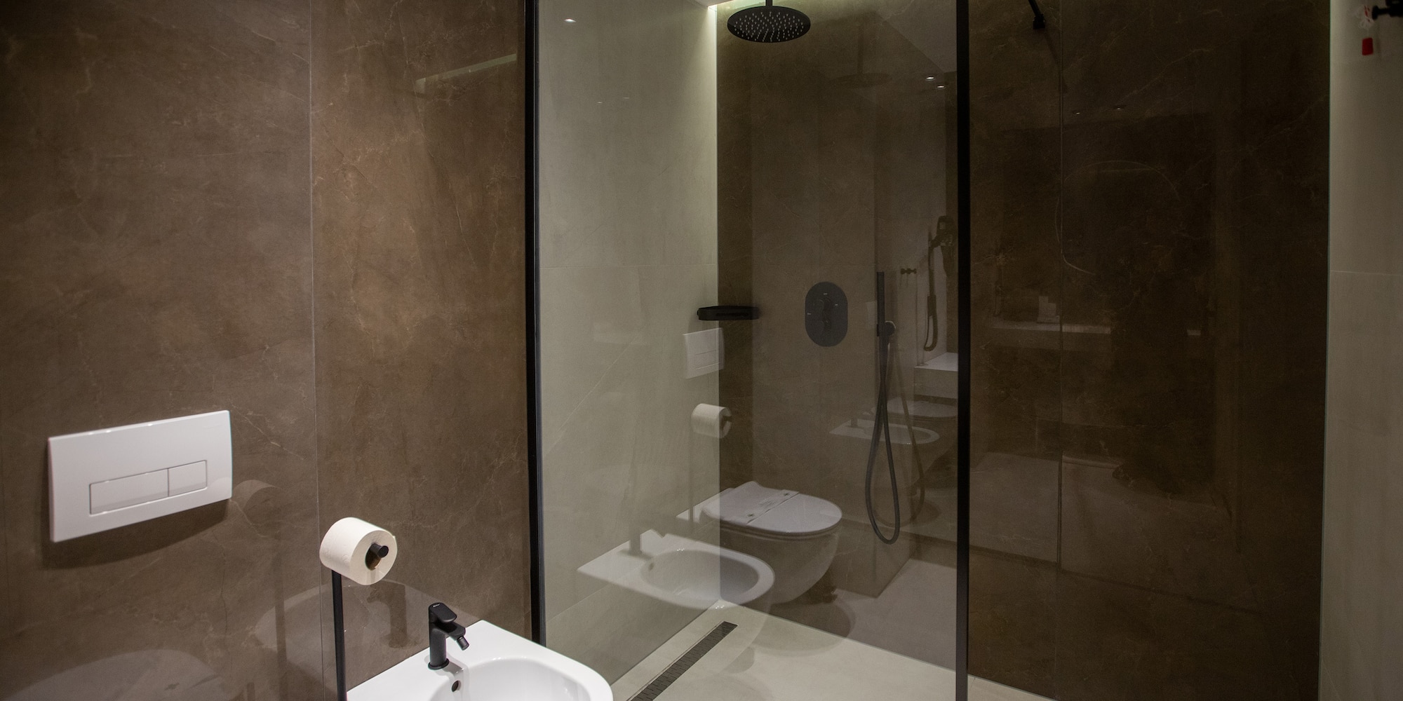 a bathroom with a shower and toilet