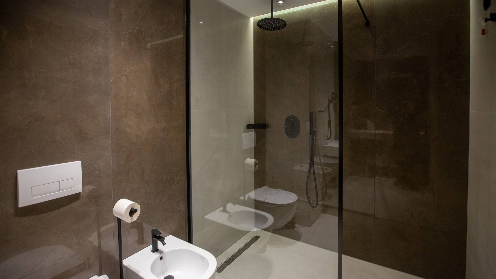 a bathroom with a shower and toilet
