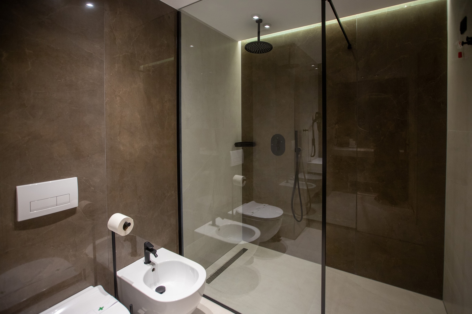 a bathroom with a shower and toilet