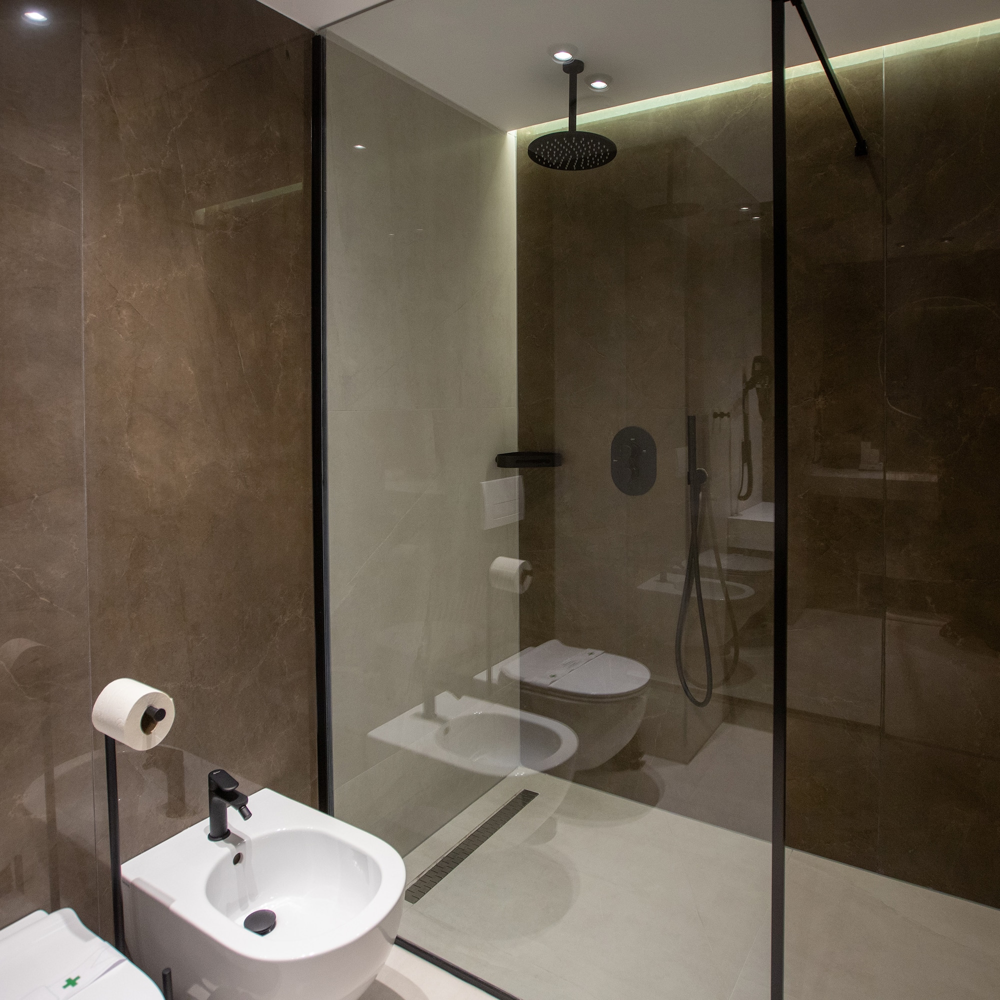 a bathroom with a shower and toilet
