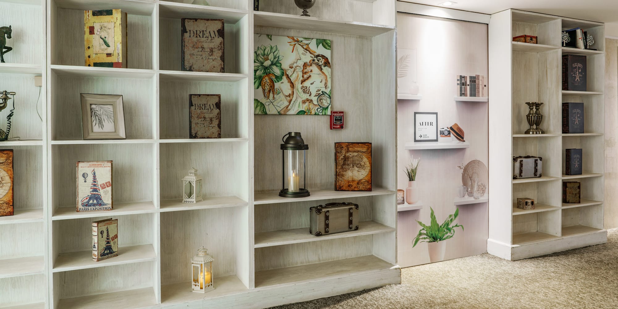 a white shelves with pictures on them