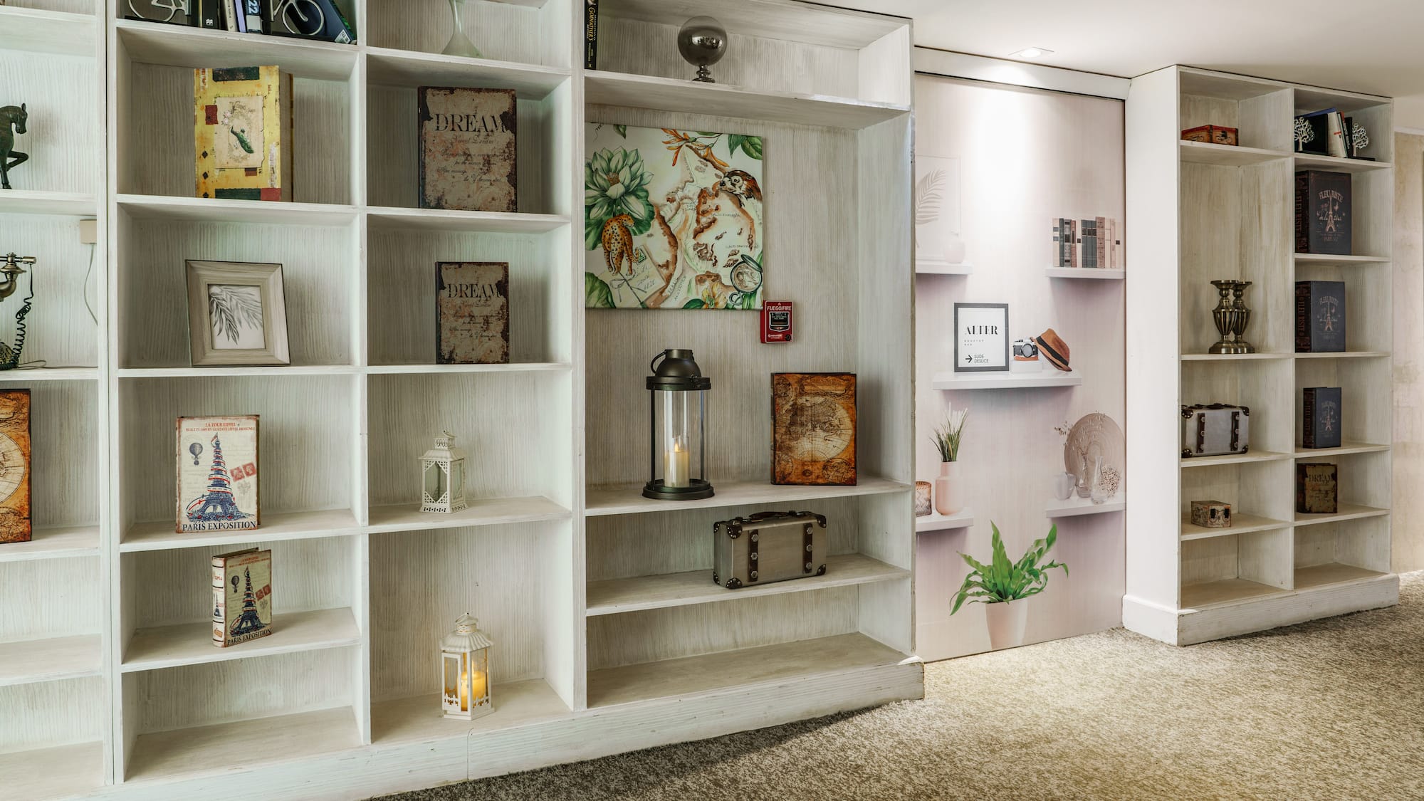 a white shelves with pictures on them