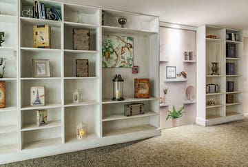 a white shelves with pictures on them