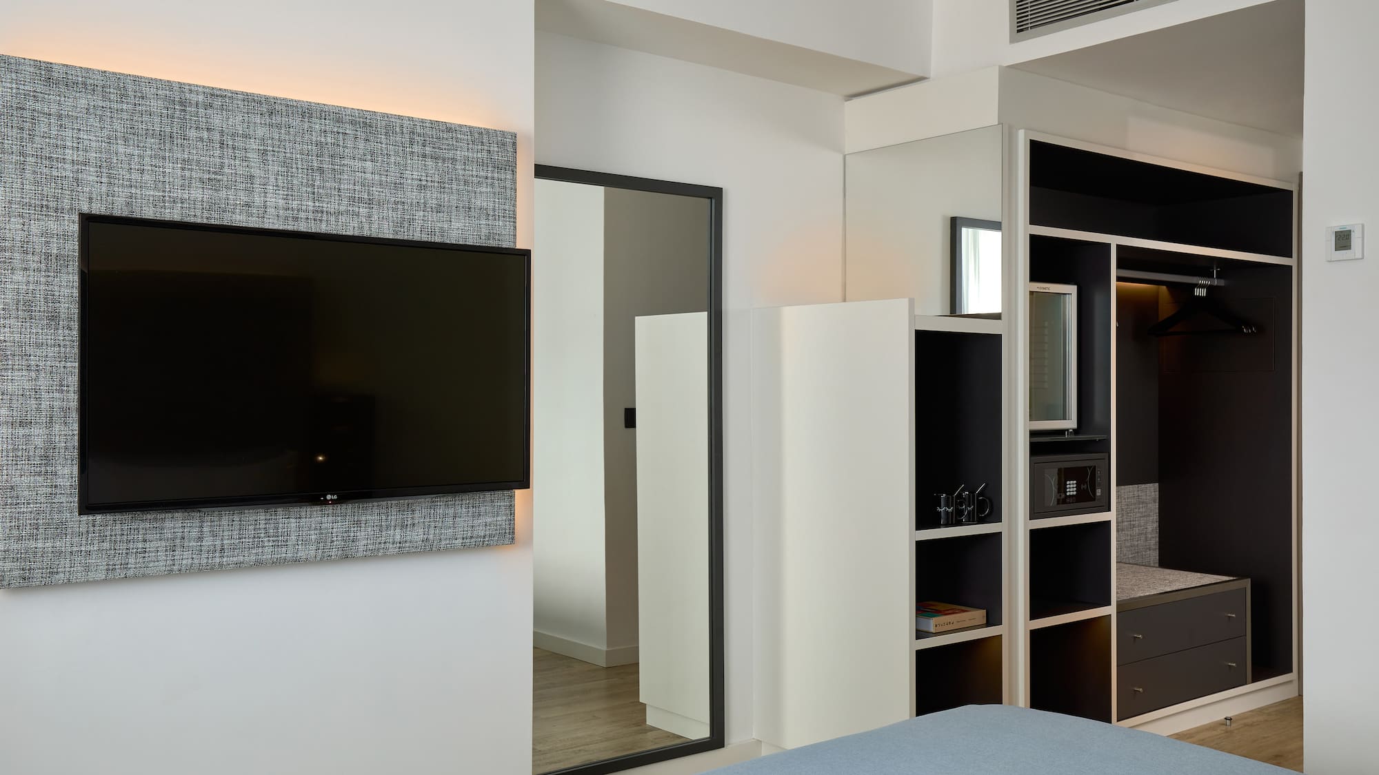 a room with a tv on the wall