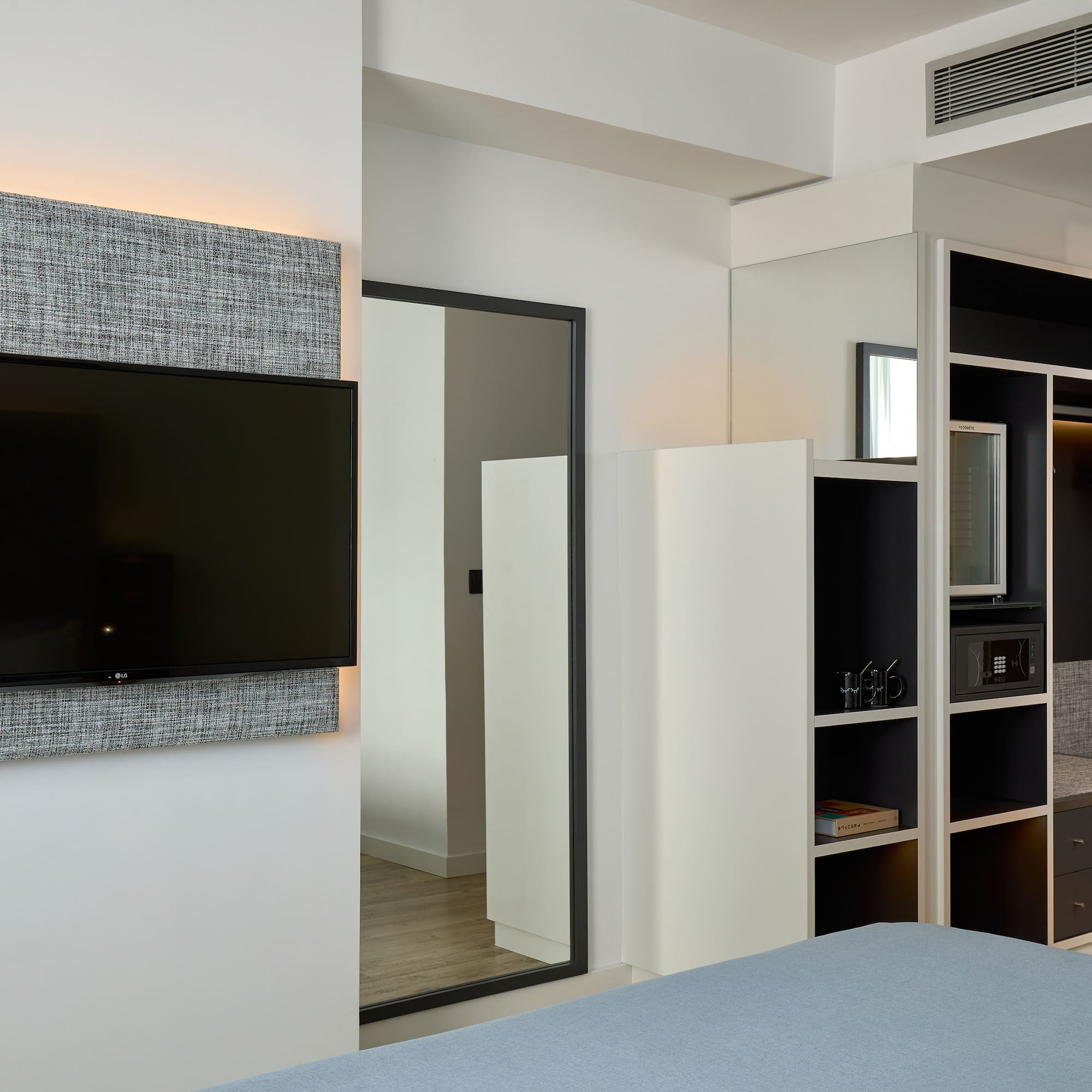 a room with a tv on the wall