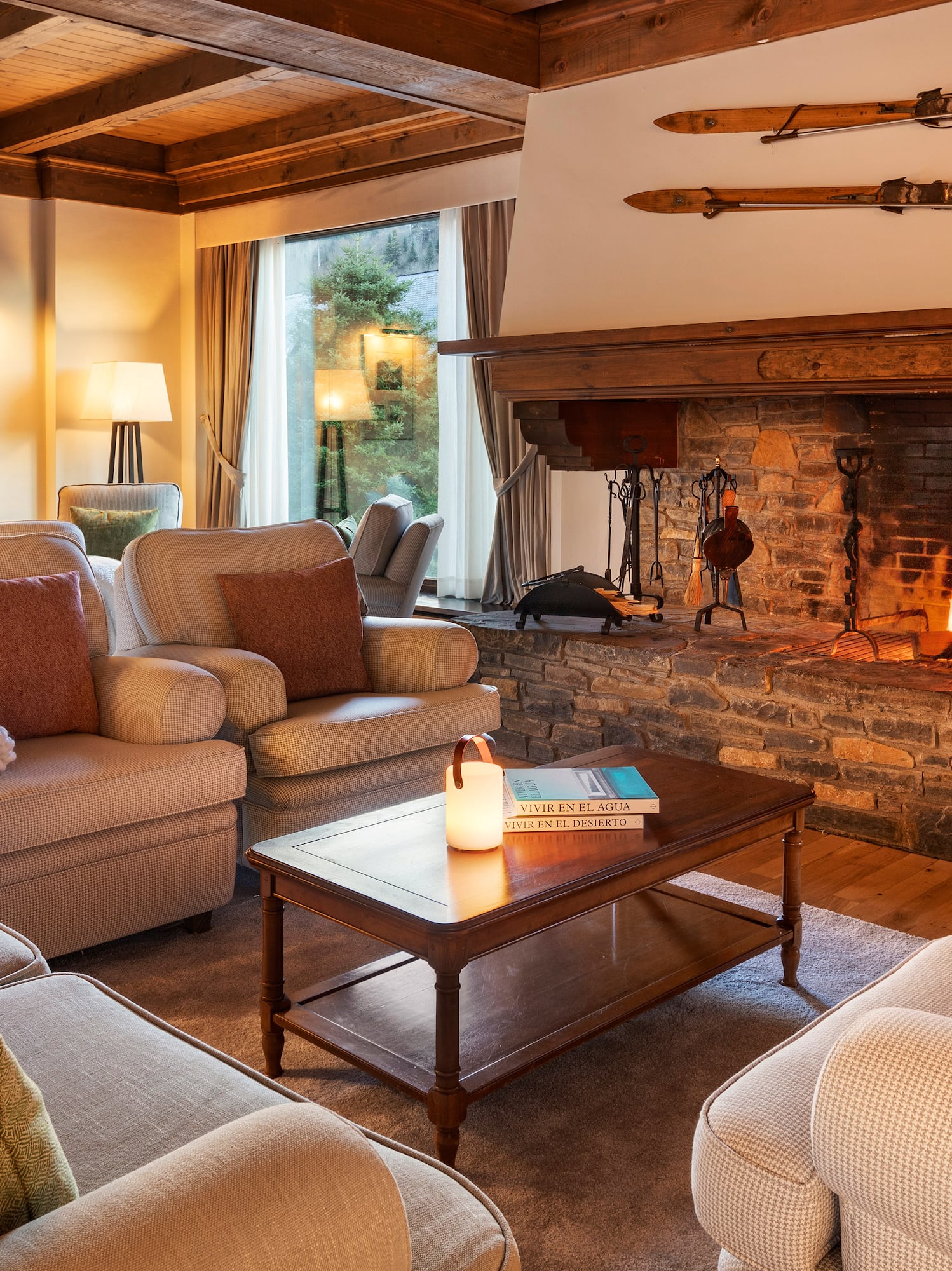 a living room with a fireplace and couches