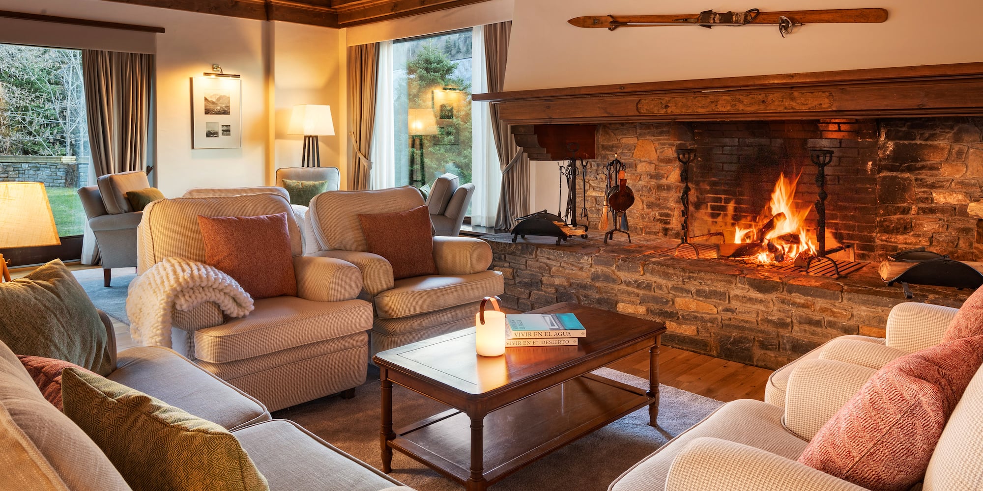 a living room with a fireplace and couches