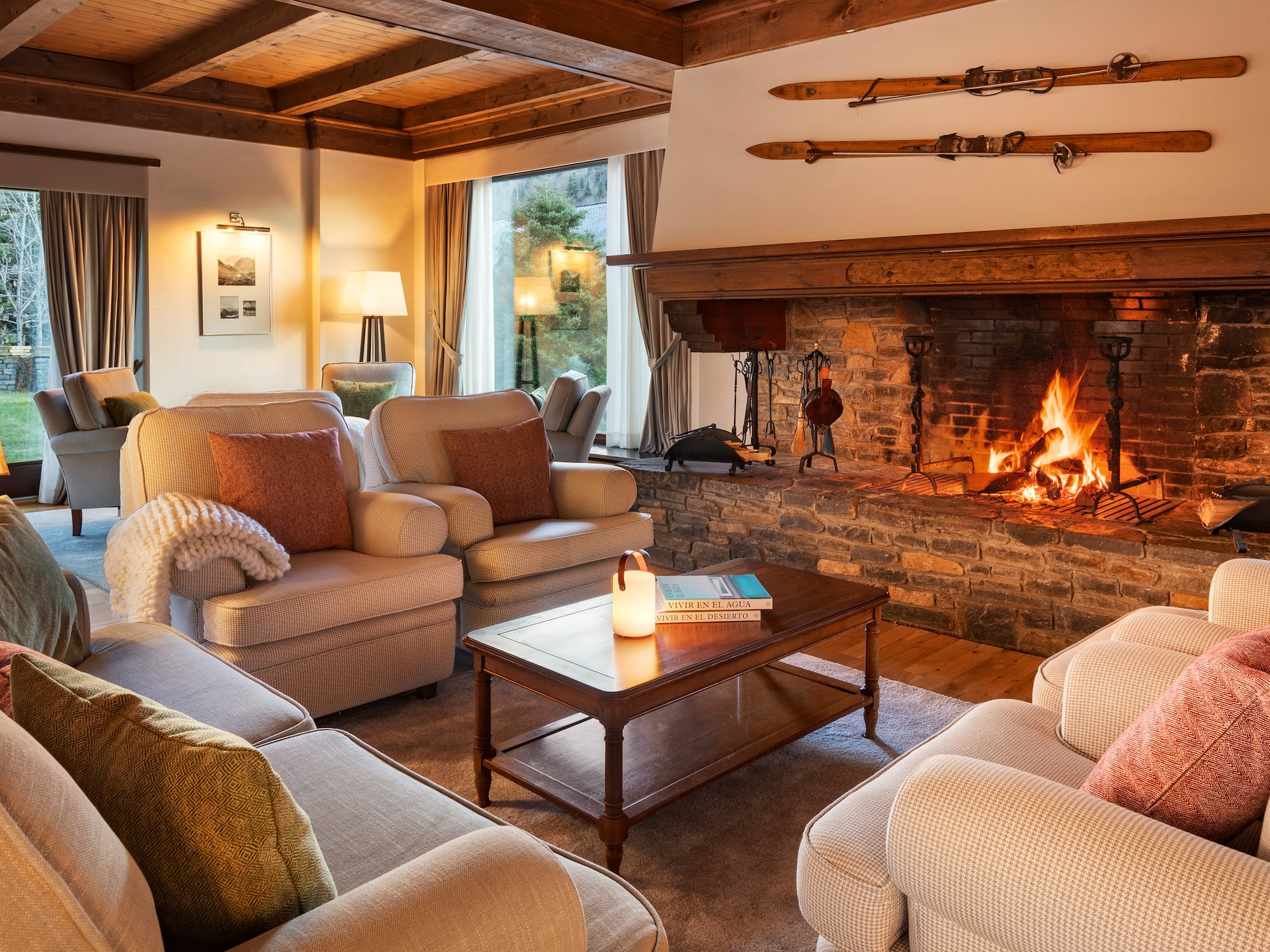 a living room with a fireplace and couches