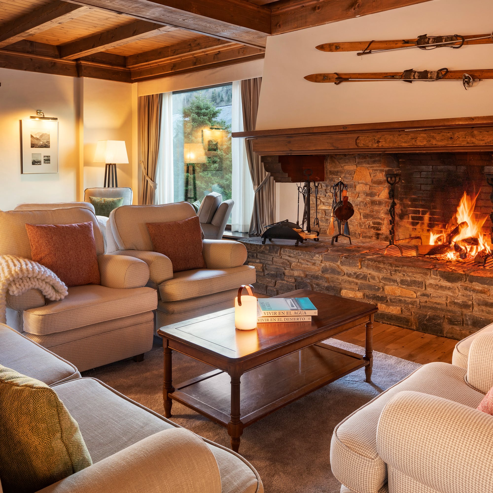 a living room with a fireplace and couches