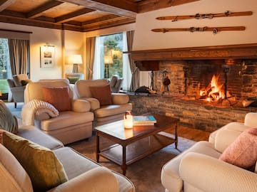 a living room with a fireplace and couches