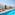 a pool with chairs and umbrellas