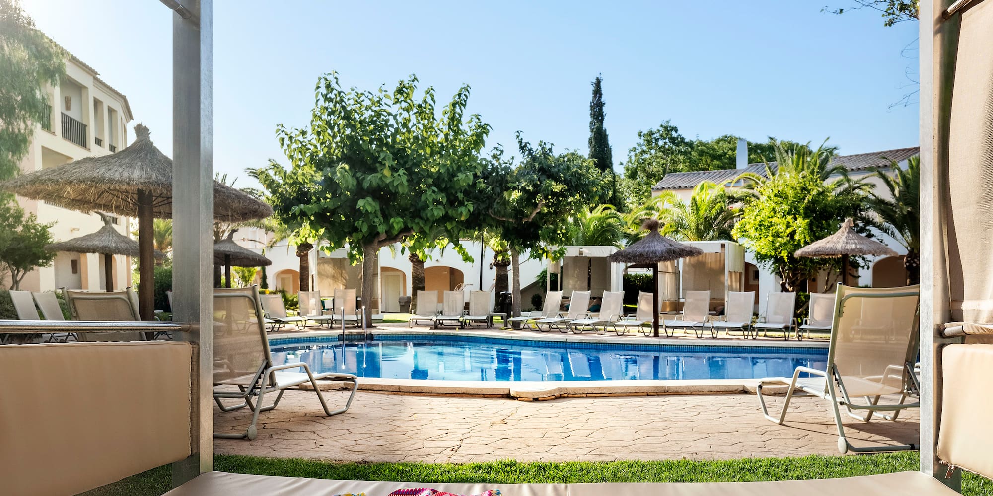 a pool with a blanket and hat on it
